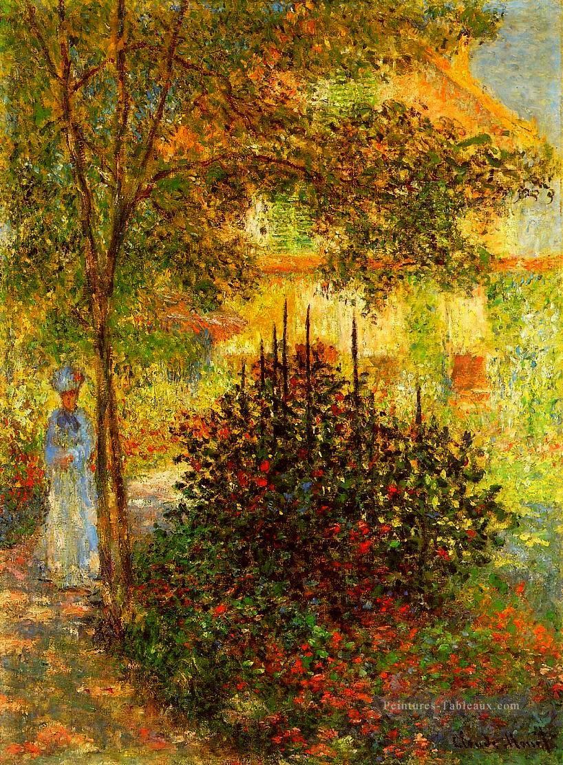 Camille Monet dans le jardin de la maison à Argenteuil Claude Monet Peintures à l'huile